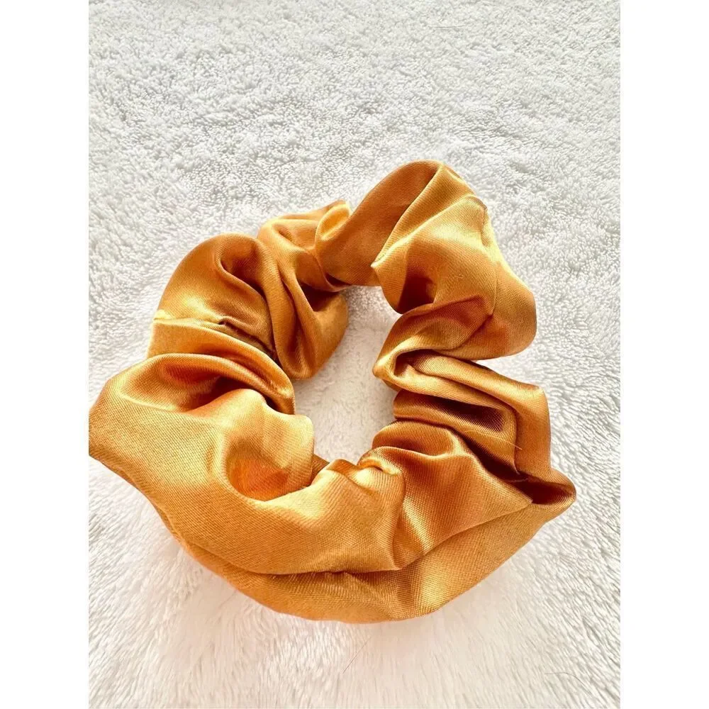 Golden orange color satin hair scrunchie